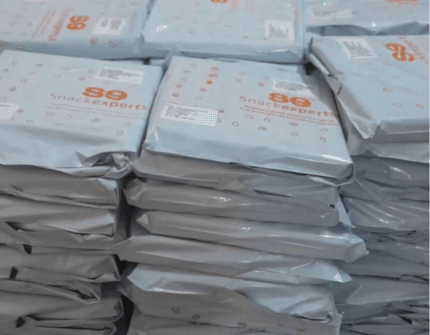 Cartons of Snackexperts snacks packed for bulk supply